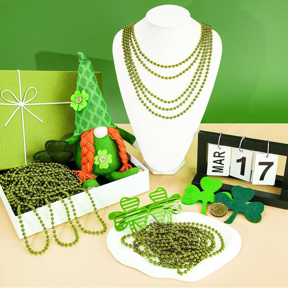 SHAOQINLIN wearing green bead necklace complements outfits at parties.