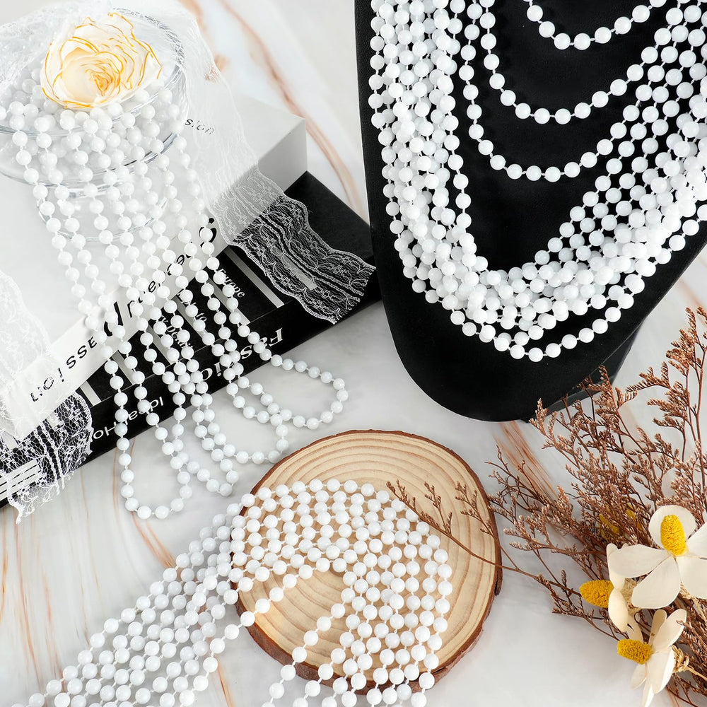 SHAOQINLIN white bead necklaces worn by model for parade throws.