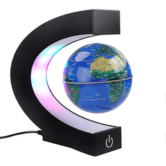 Shoclematirul floating globe with blue LEDs enhances desk decor.