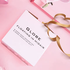 Shoclematirul sleek globe sculpture enhances modern workspace.