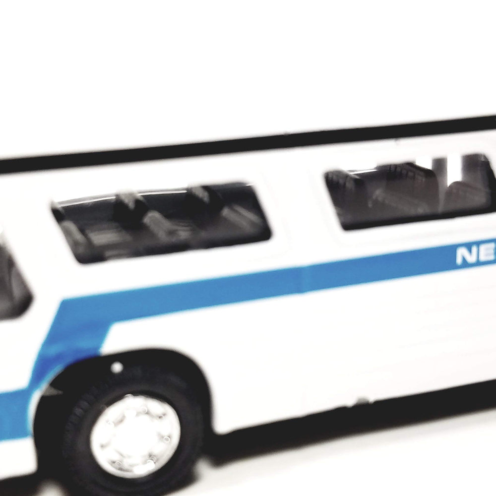 Showcast white passenger bus collectible model with detailed interior.