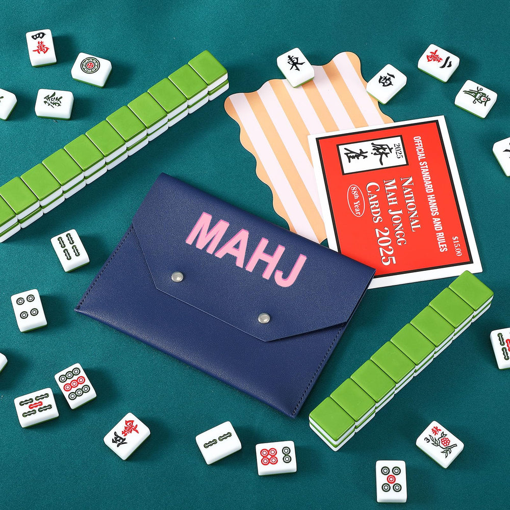 SilTriangle navy mahjong card holder tucked in a bag for easy travel.