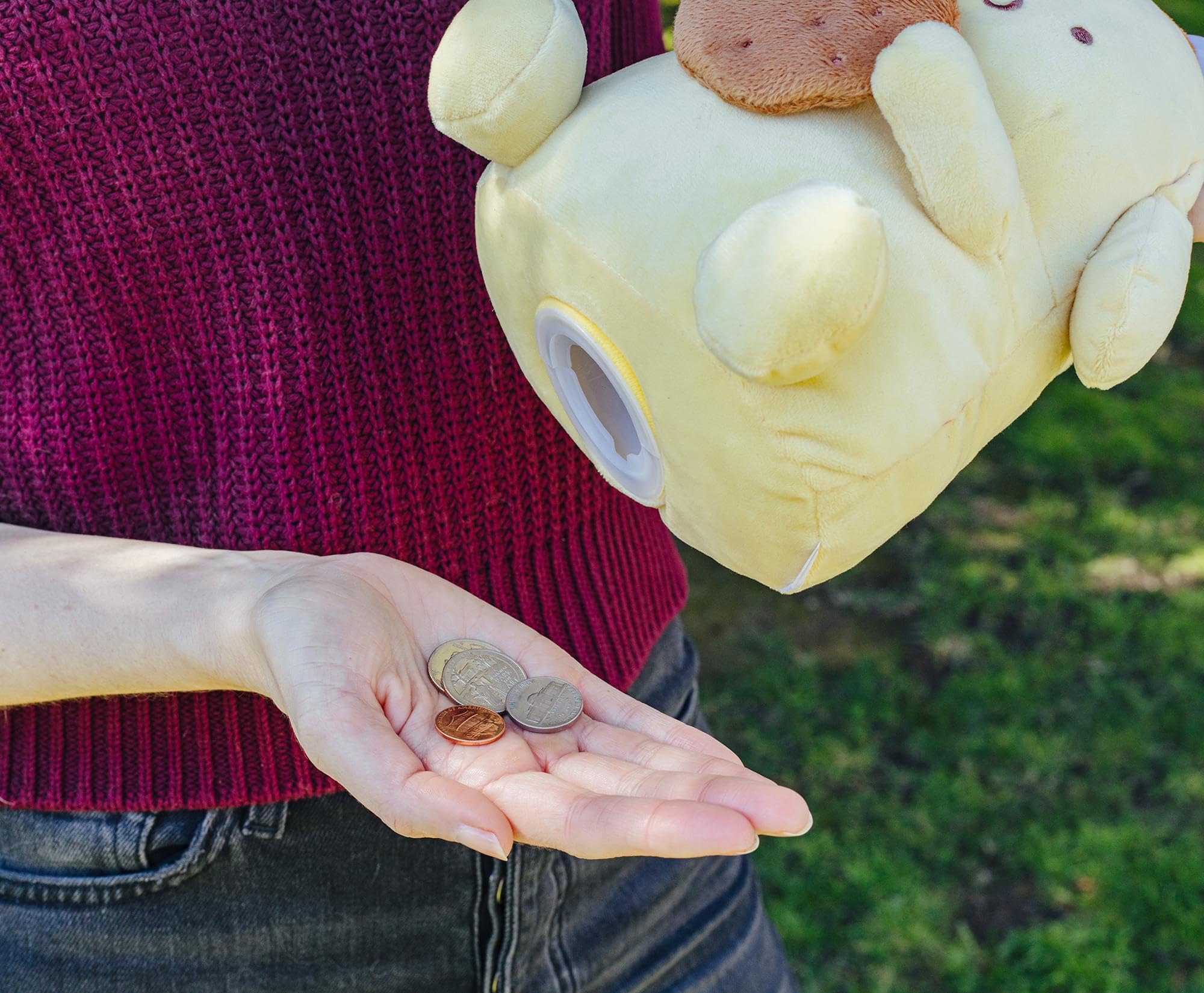 Silver Buffalo Pompompurin plush money bank gift-ready packaging.