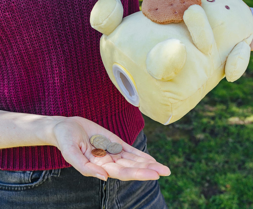 Silver Buffalo Pompompurin plush money bank gift-ready packaging.