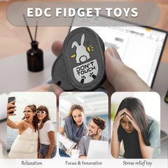 SKEDC Desperate Rabbit Slider in-hand shot, ergonomic grip for focused fidget play.