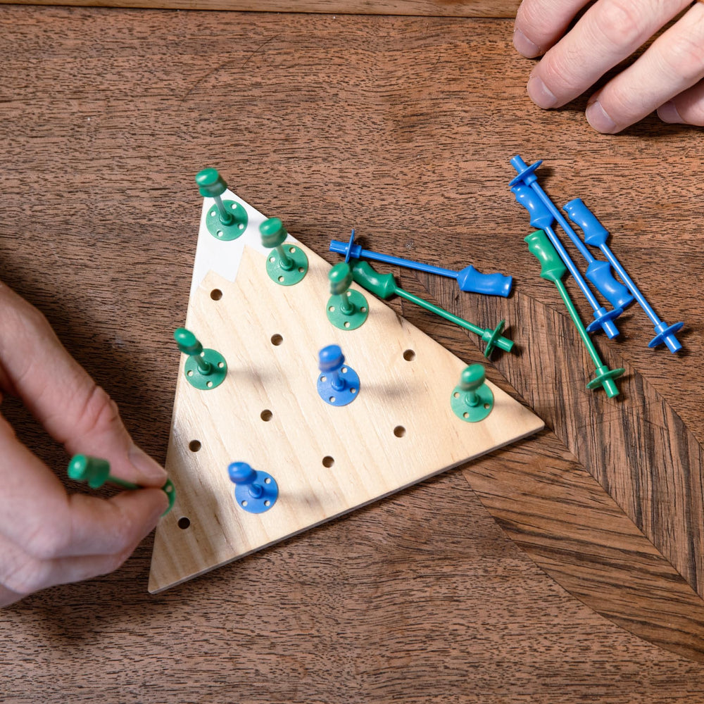 Ski House Games travel-compact case supports on-the-go apres-ski fun.