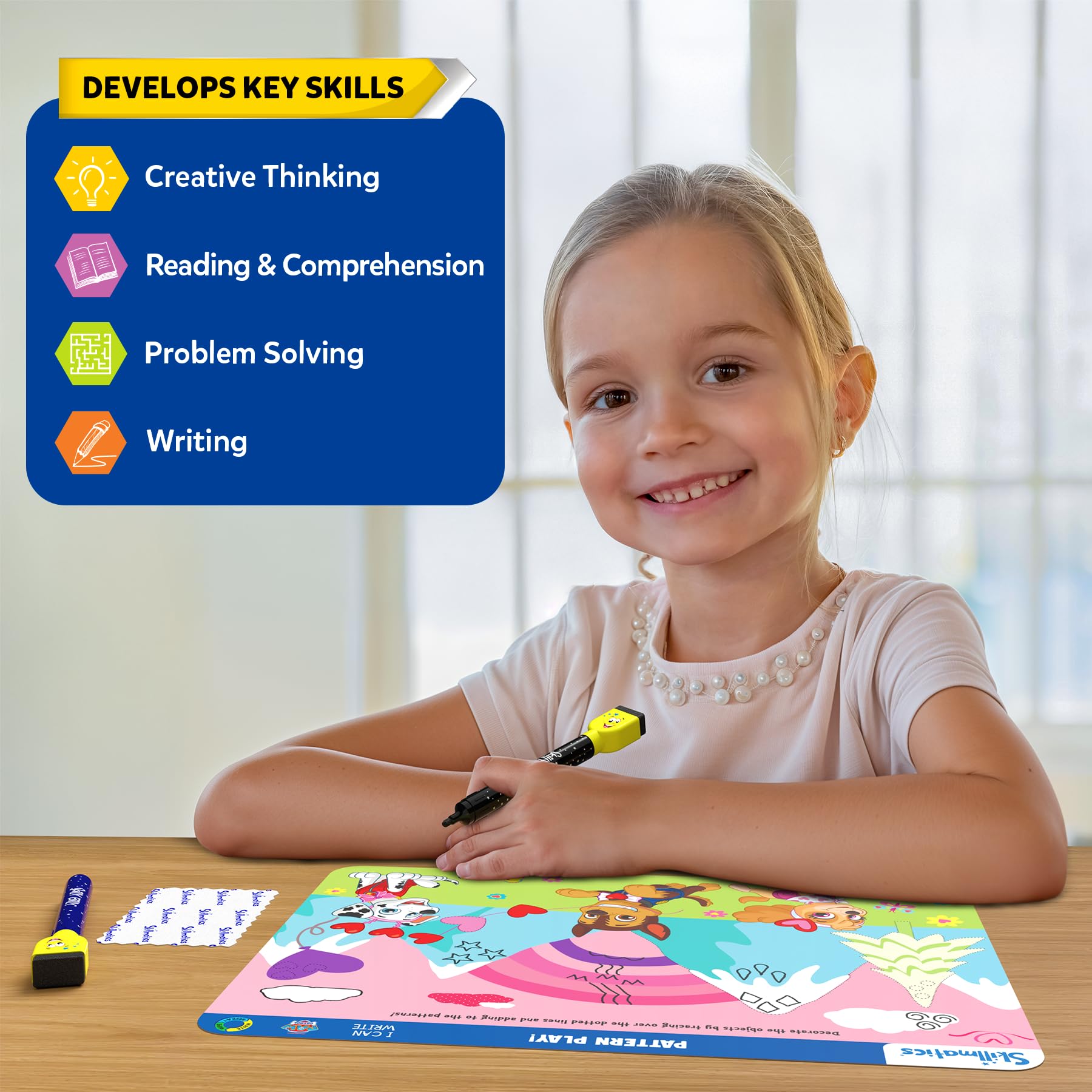Kids tracing numbers and letters on PAW Patrol scenes with Skillmatics mats.