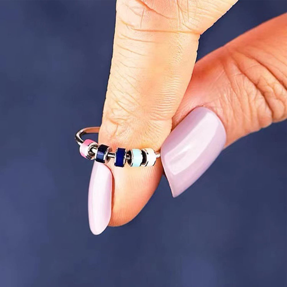 Skyfun beaded spinner ring on display, bold colors for mood-friendly style.