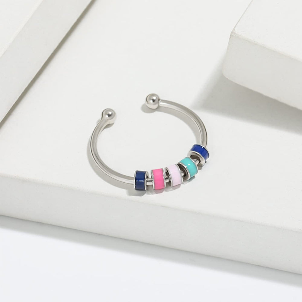 Skyfun spinner ring on daughter's finger, vibrant colors for stylish distraction.