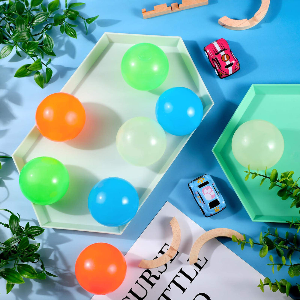Skylety glow sticky ball in hand showing portable stress relief toy