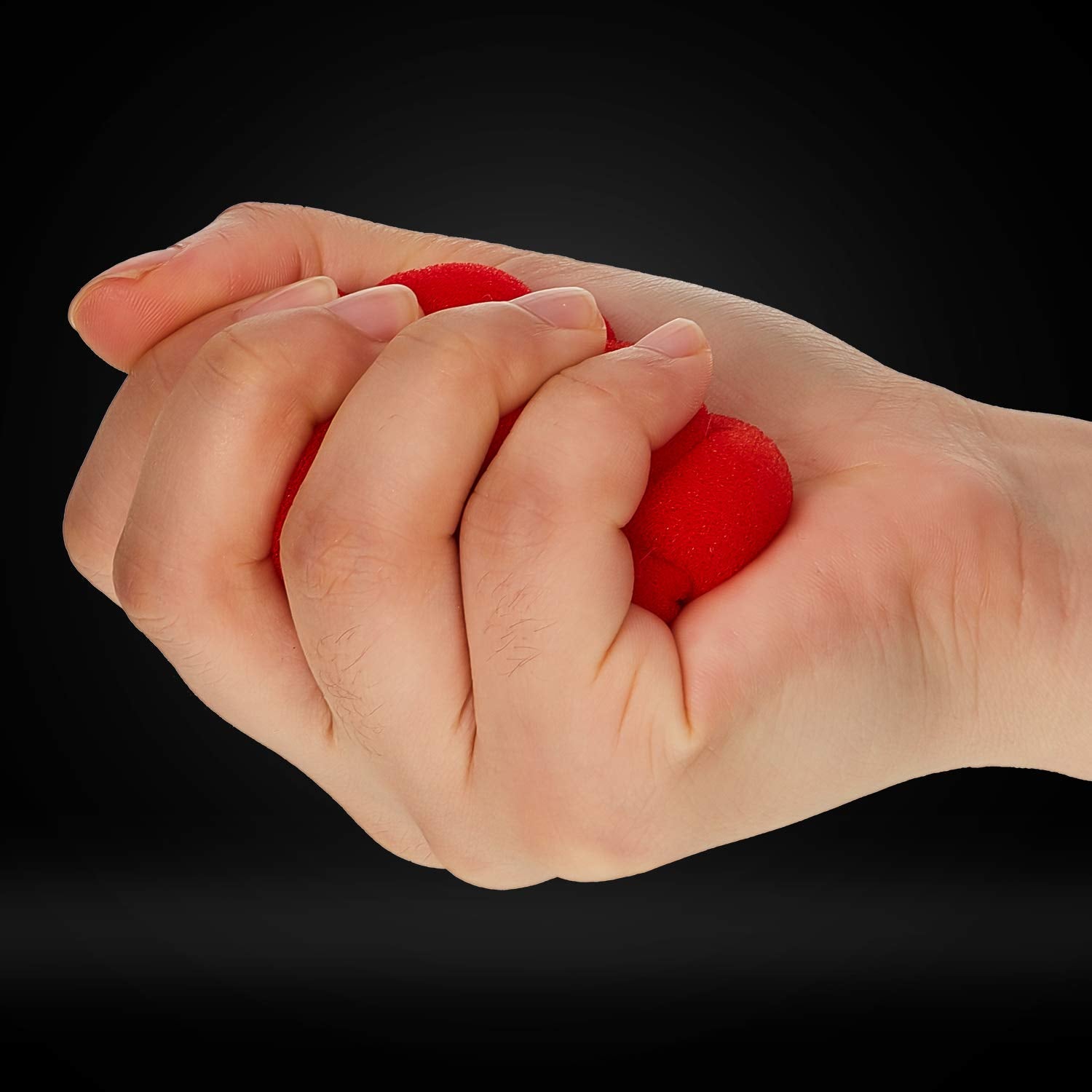 Skylety red sponge balls in hand demonstrating a vanish routine