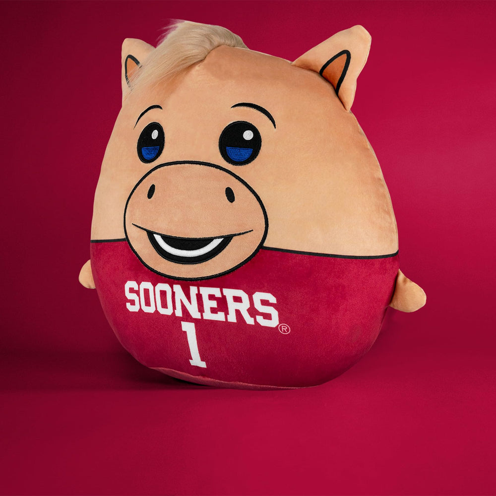 Sleep Squad Boomer 12in plush on couch, ideal evening snuggle partner