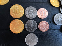 Sleeve Kings 50 metal coins closeup, ready to upgrade your board game experience with tactile weight.