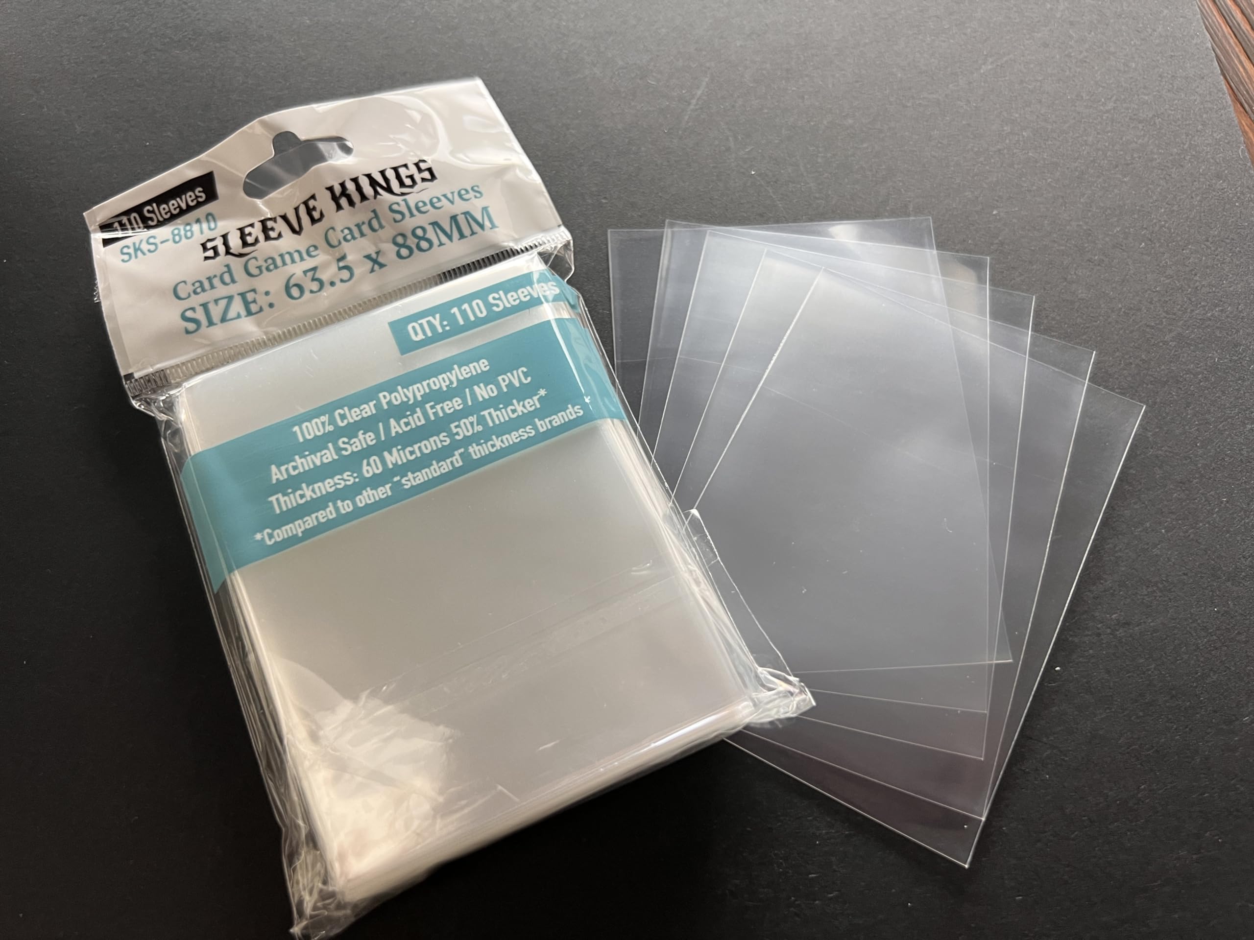 Sleeve Kings transparent sleeves keeping cards secure during play.