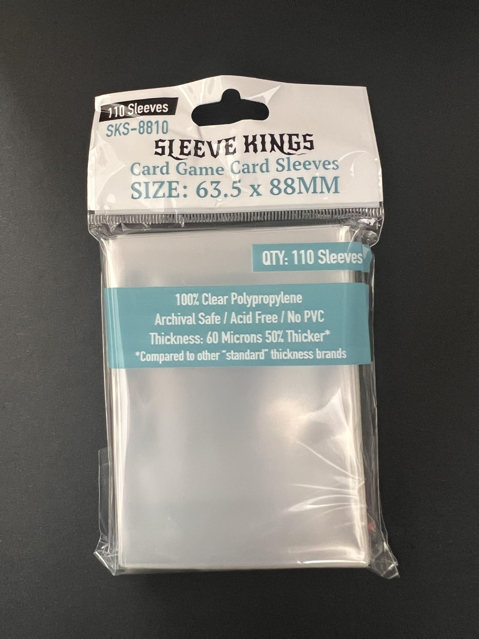 Sleeve Kings clear sleeves encasing a shuffled deck for durable protection.