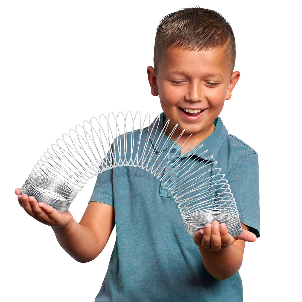 Giant Slinky metal coils showcase oversized design for hands-on exploration.