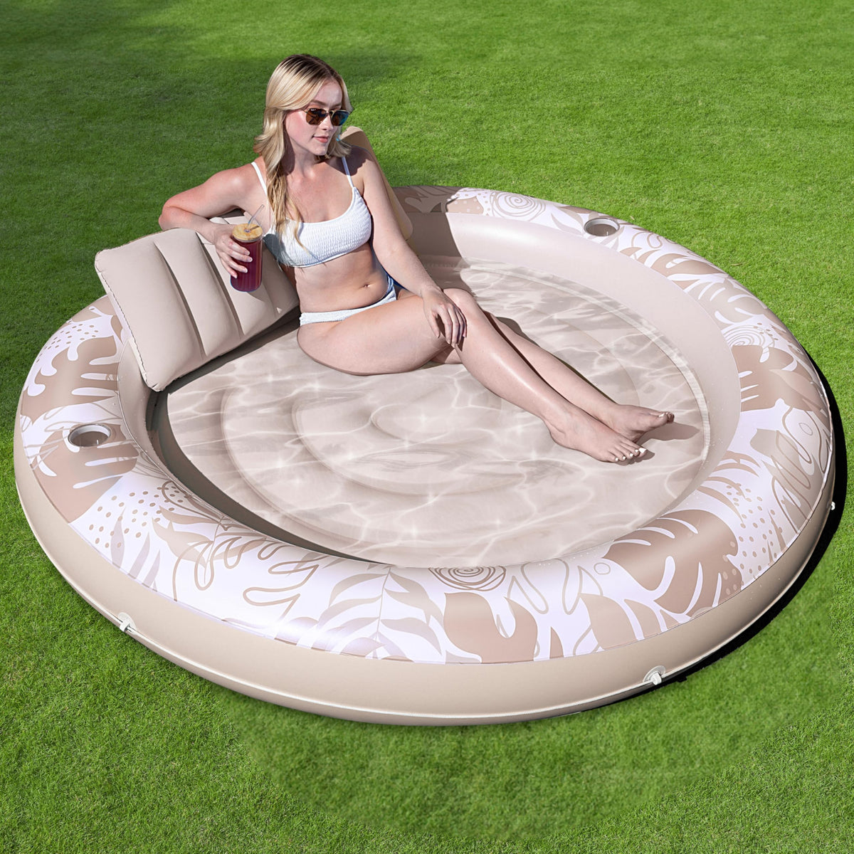Sloosh 72-inch circular tanning pool float with pillow for relaxing sunbathing.
