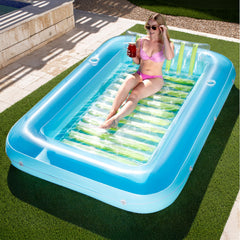Sloosh inflatable tanning pool lounger setup showing XL blue-green color ideal for backyard sunbathing.