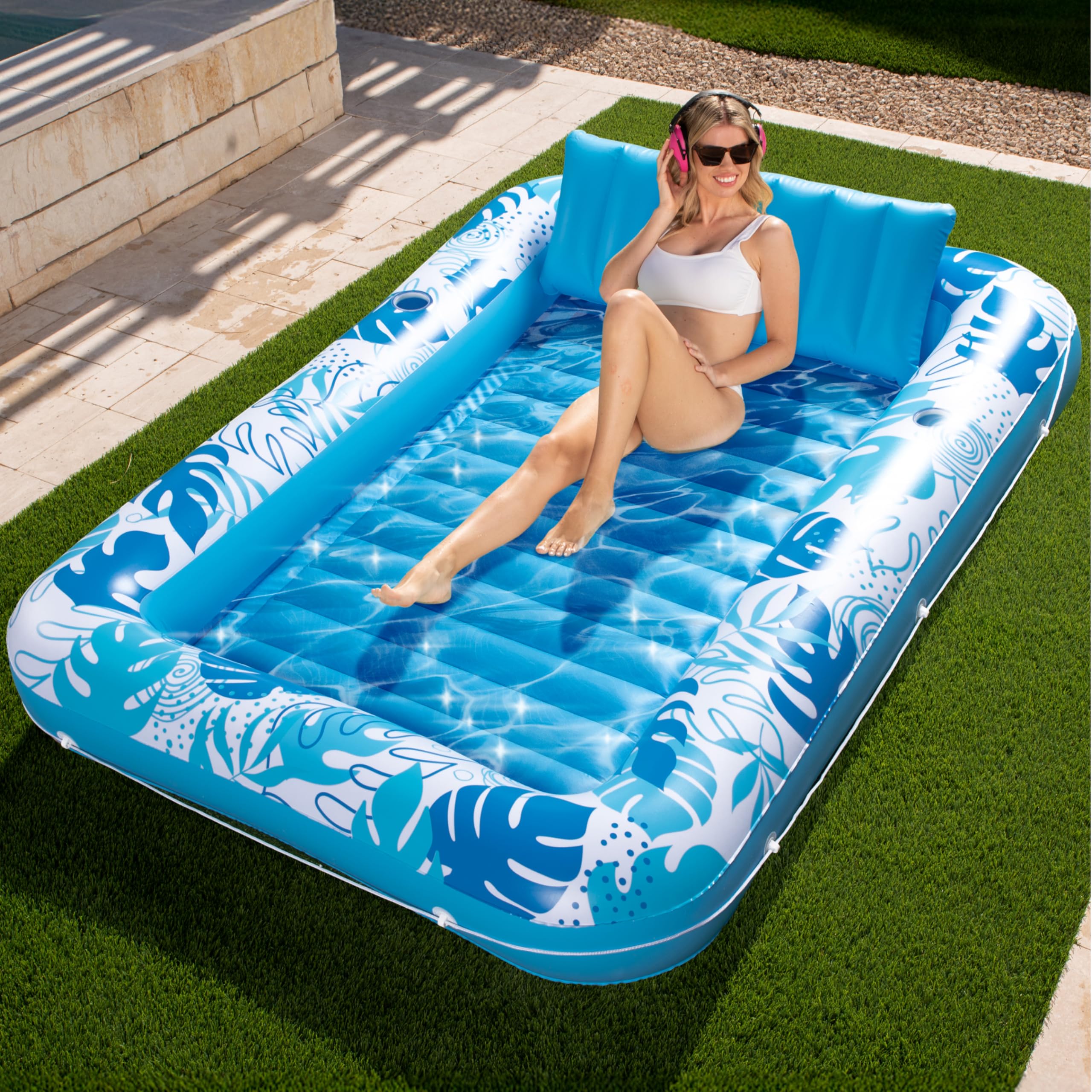 Sloosh inflatable tanning pool lounger offers a large 85 by 57 inch shared surface for two.