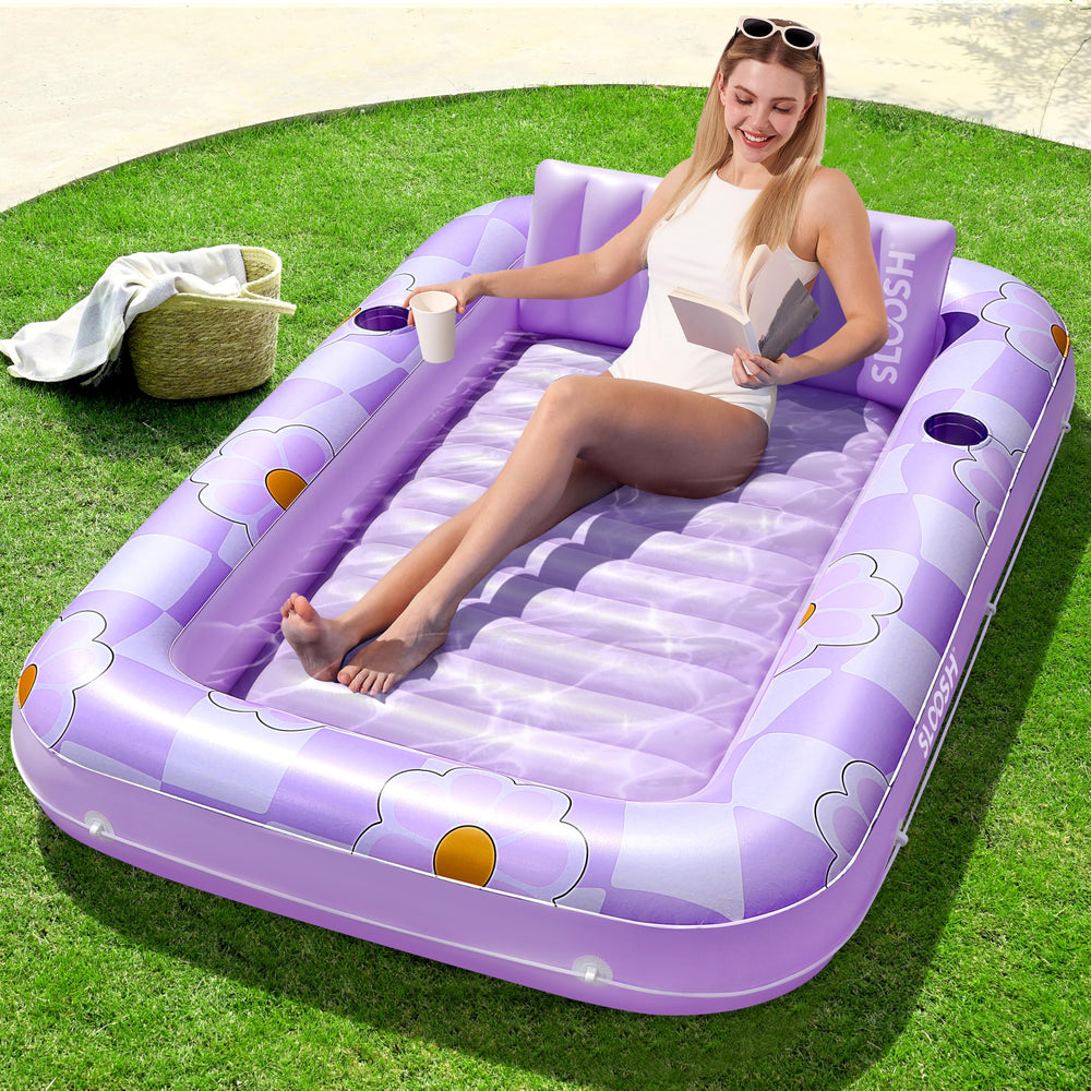 Sloosh inflatable tanning pool lounger in purple chase flower for solo sunbathing by the pool.