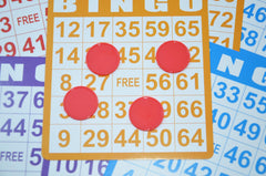 Smartdealspro red counters used as bingo-style learning chips