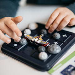 SmartGames Asteroid Escape pieces sliding to form a path boosts logic.
