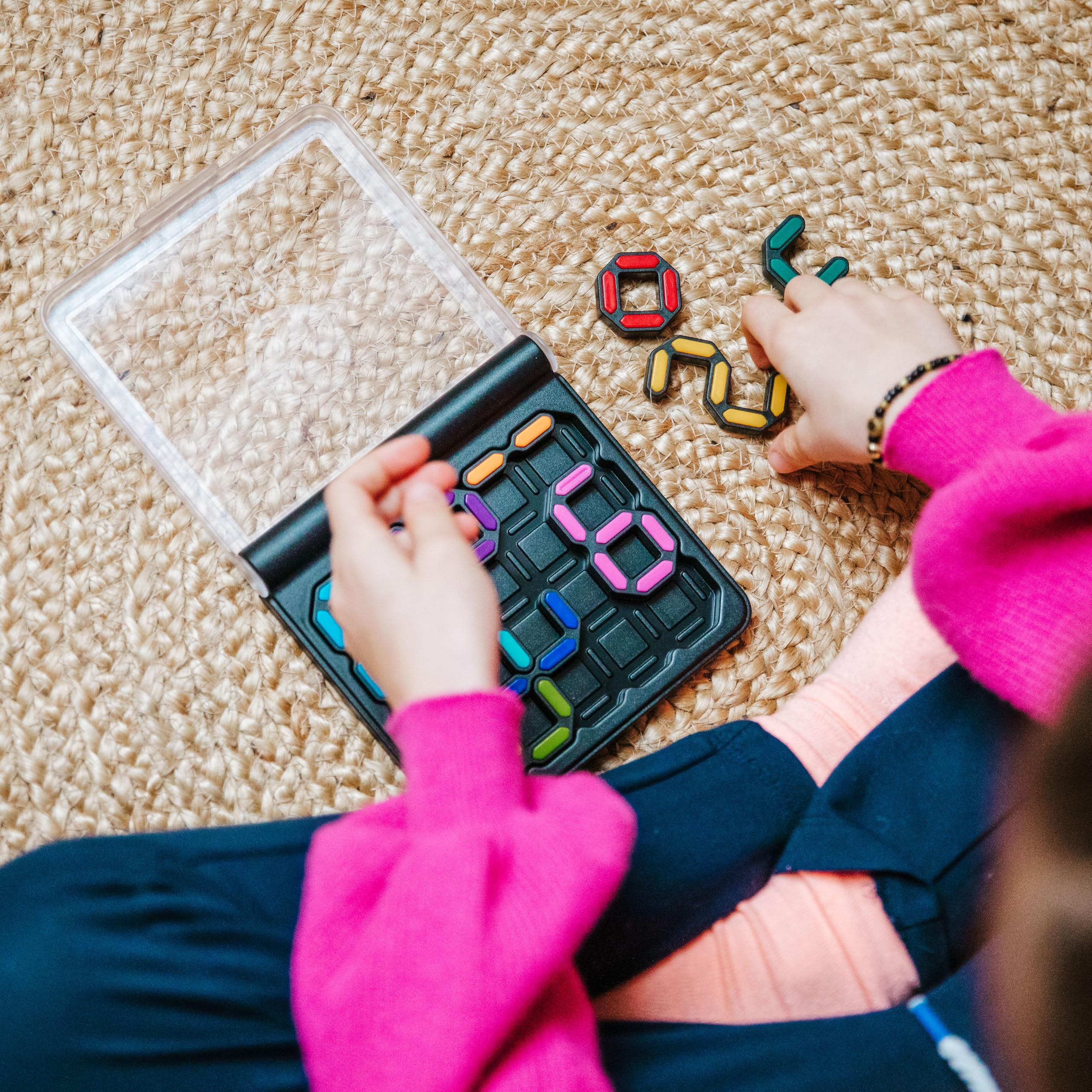 SmartGames IQ Digits colorful puzzle pieces arranged on the grid support math thinking