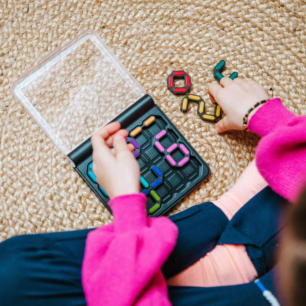 SmartGames IQ Digits colorful puzzle pieces arranged on the grid support math thinking