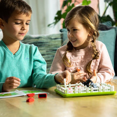 SmartGames Smart Farmer wooden fences arranged on the board, promoting spatial reasoning during setup.