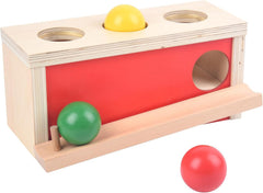 Smartwo Montessori box with ball drop showing early hand-eye coordination.