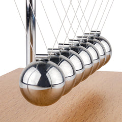Beads from Smilesorg Newton's Cradle demonstrated in classroom setup