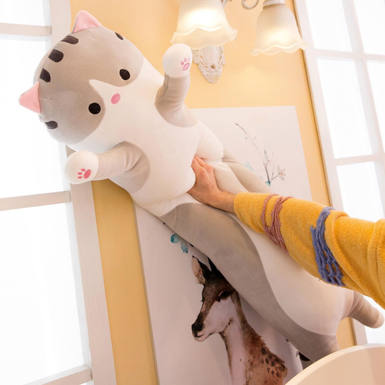 Somao long cat pillow on a bed creates a cozy ambience for restful evenings.