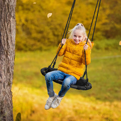 Sorbus Saucer Tree Swing kid using seat for outdoor active play