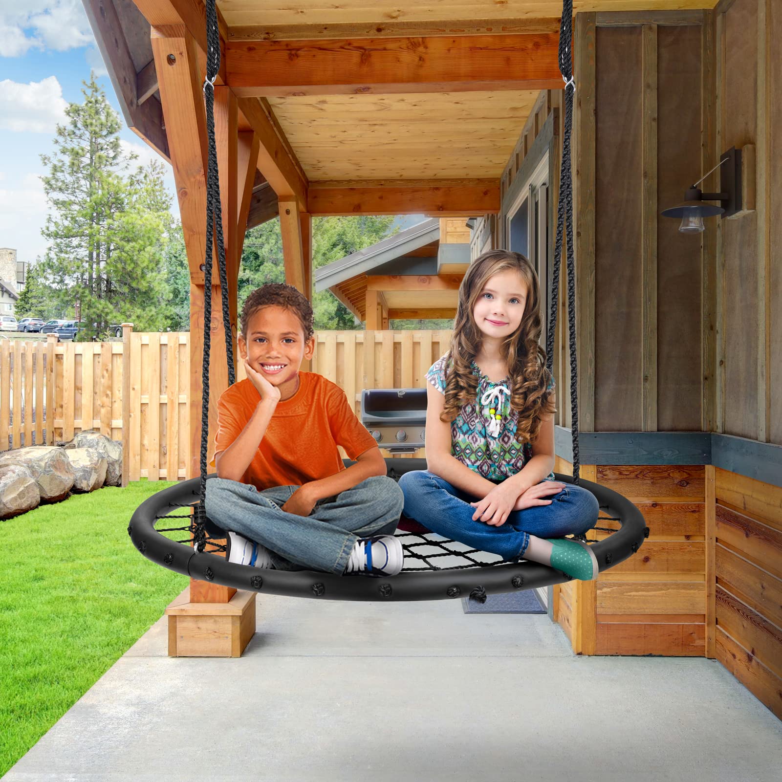 Sorbus Saucer Tree Swing mounted on a tree enables versatile outdoor play.