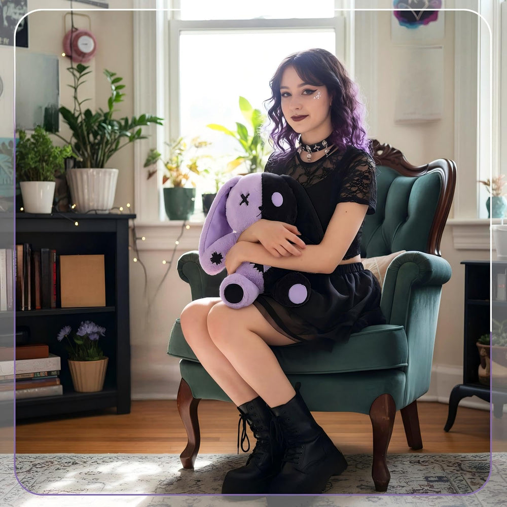 Sotiff gothic bunny plush acts as a comfortable reading pillow.