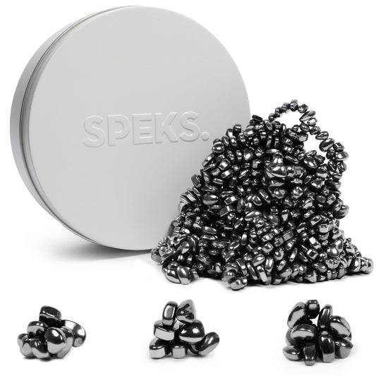 Speks Crags ferrite putty with ferrite stones in a tin for quiet desk relief.
