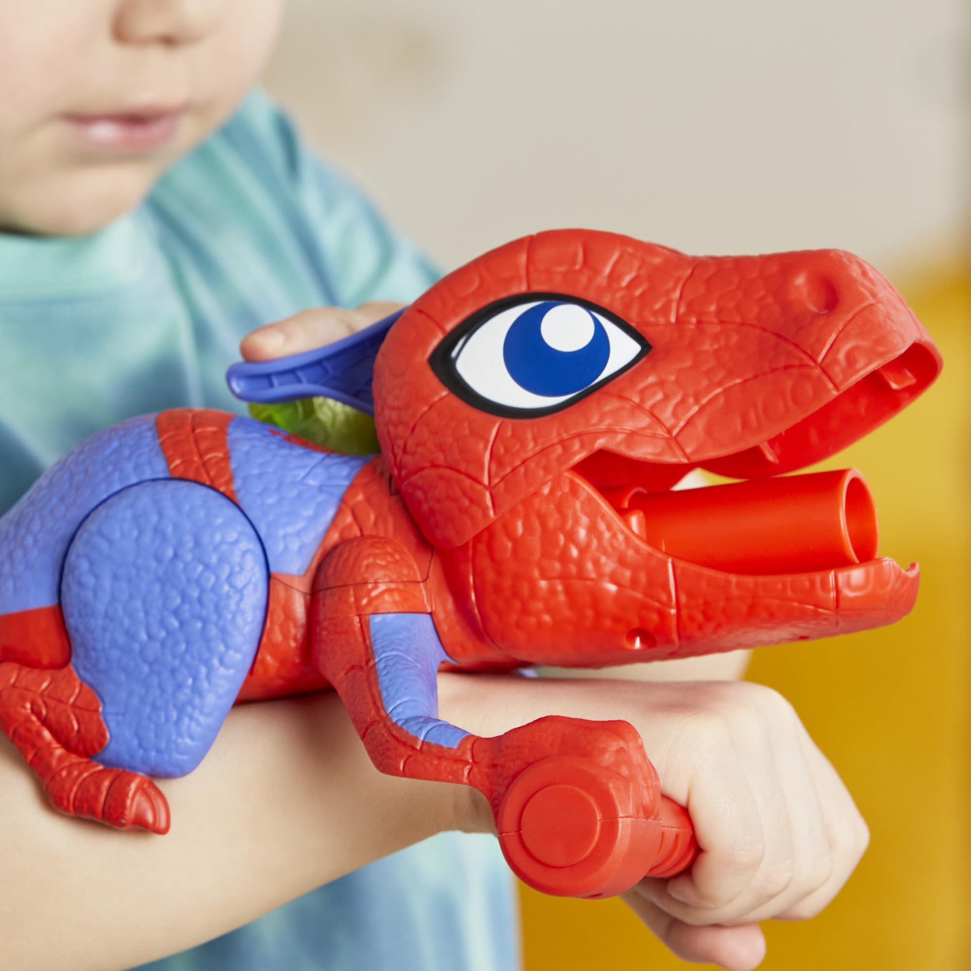Spidey and His Amazing Friends Spidey-Rex tail pull ready for quick pretend launches.