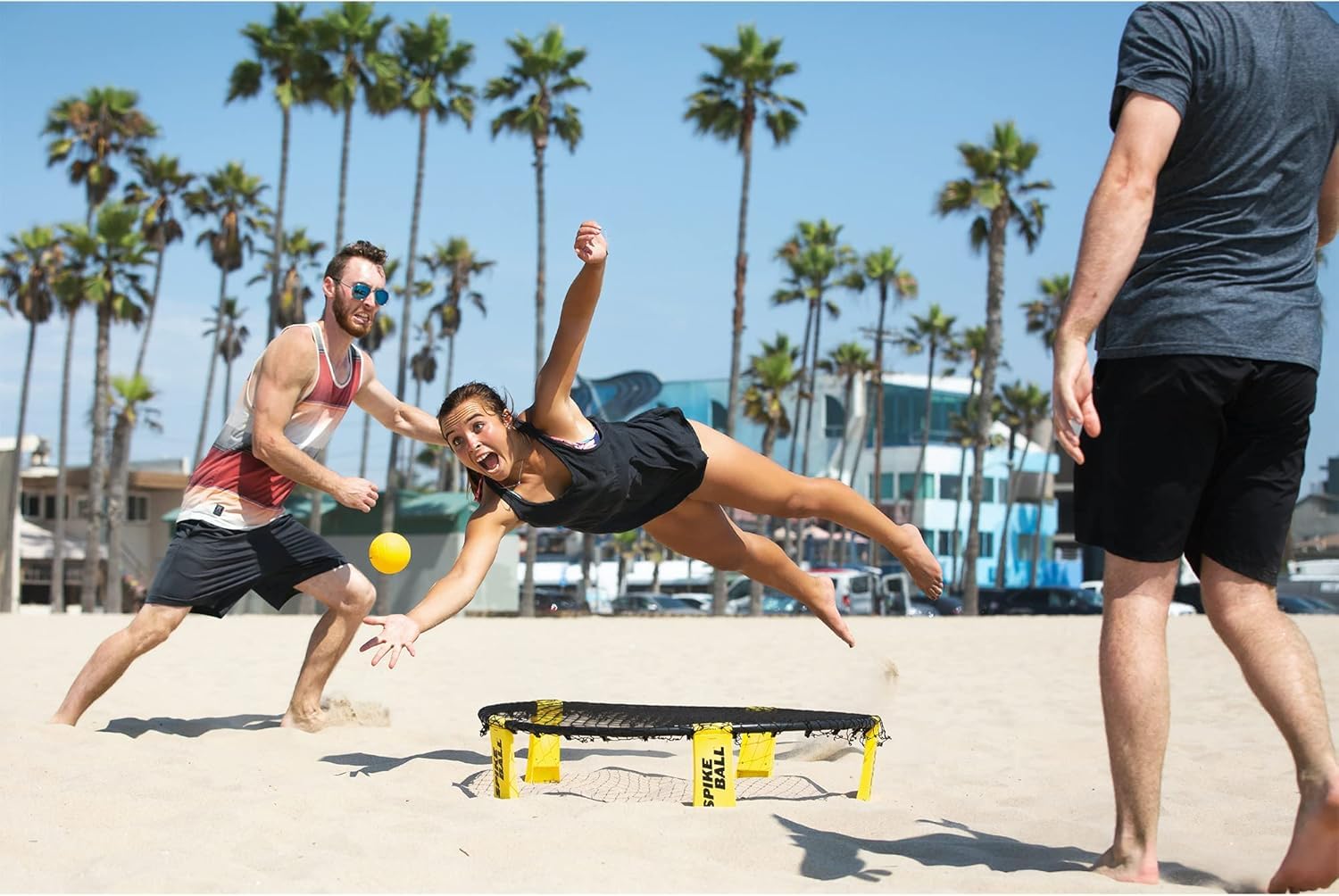 Beach play with Spikeball set illustrates sand-friendly practice.