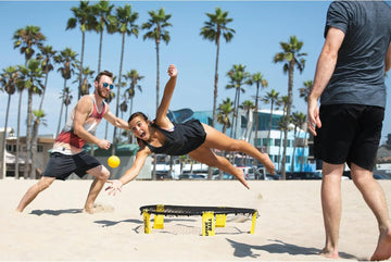 Beach play with Spikeball set illustrates sand-friendly practice.
