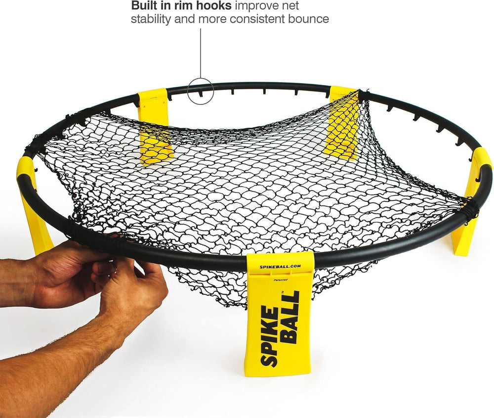 Spikeball net and frame demonstrate durability during grass games.