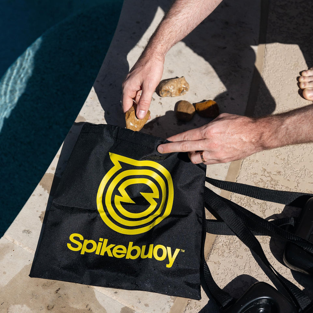 Leg floats attach to Spikeball set for buoyant stability.
