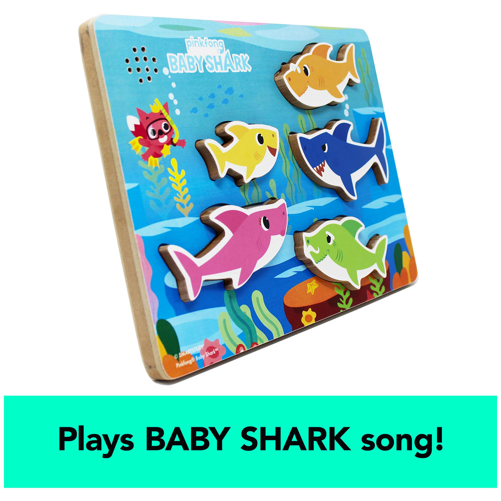 Children trigger the Baby Shark song as pieces snap into place on the board.