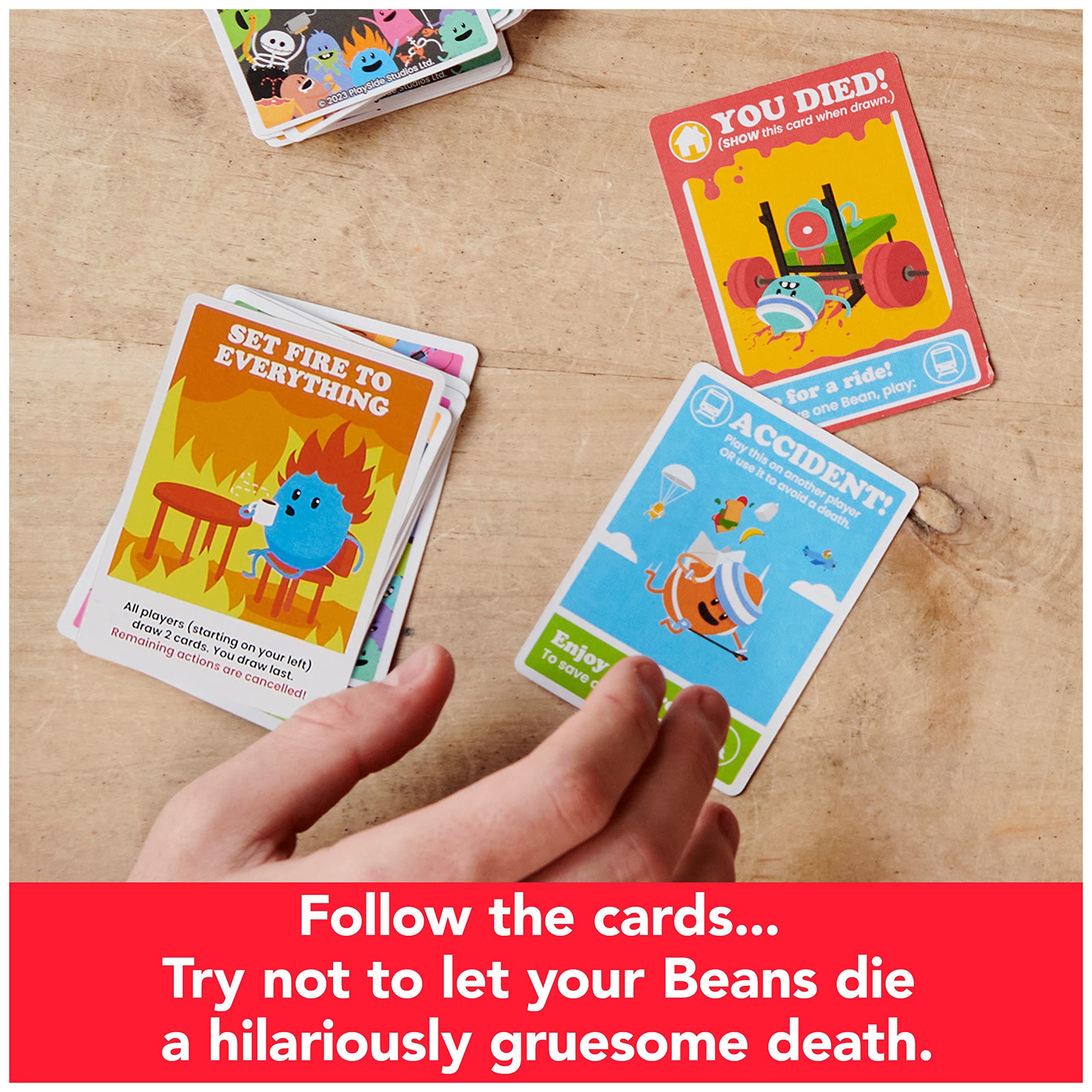 Rules booklet open as players discuss silly consequences