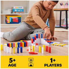 Accessories and templates help design repeatable chain reactions in domino art.