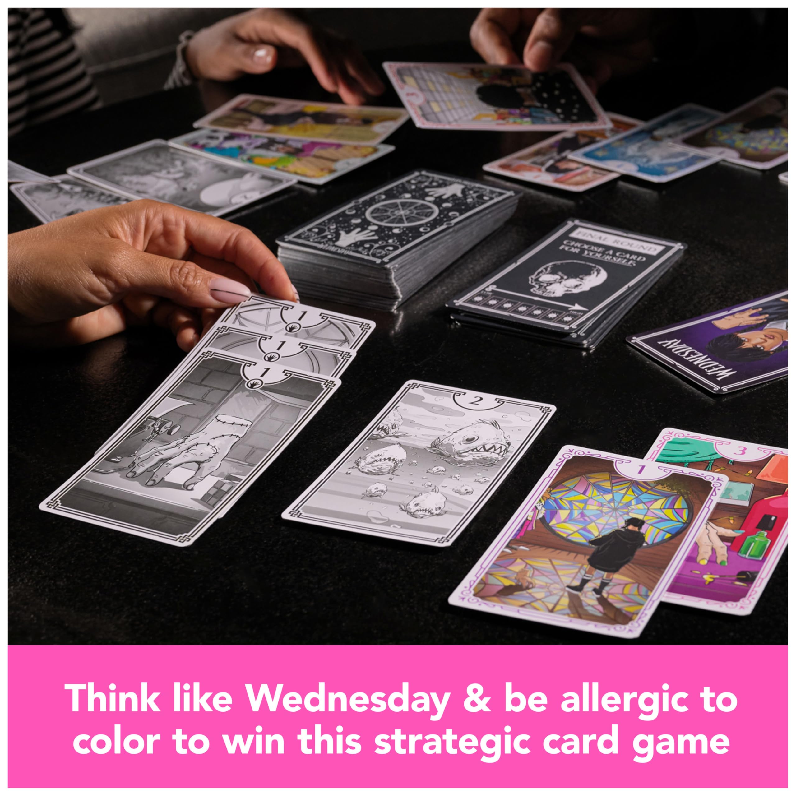 Spin Master Wednesday card game setup showing black and white cards for strategy.