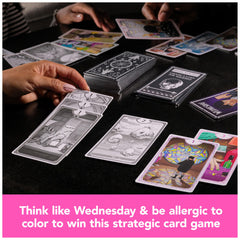 Spin Master Wednesday card game setup showing black and white cards for strategy.