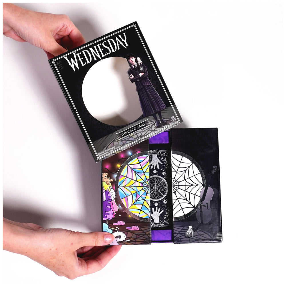 Spin Master Wednesday player cards in hand illustrate plan to maximize points.