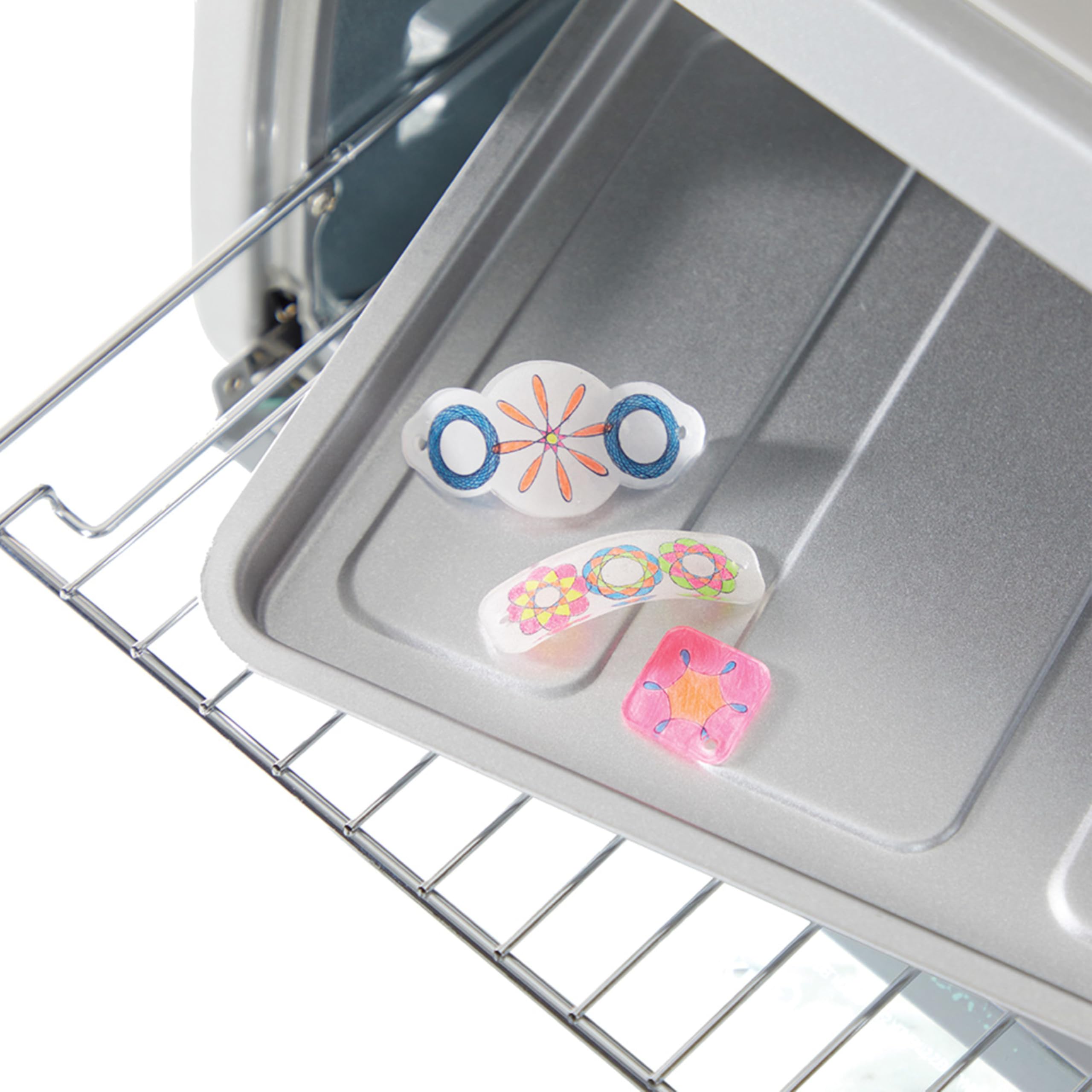 Spirograph Shrink Charms wearable jewelry: easy crafting for kids to wear and share.