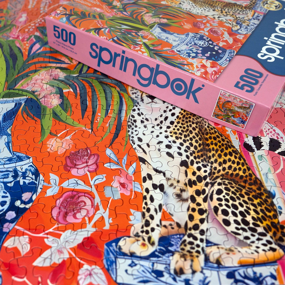 Springbok orange and pink backdrop with the cheetah design for an eye-catching puzzle.