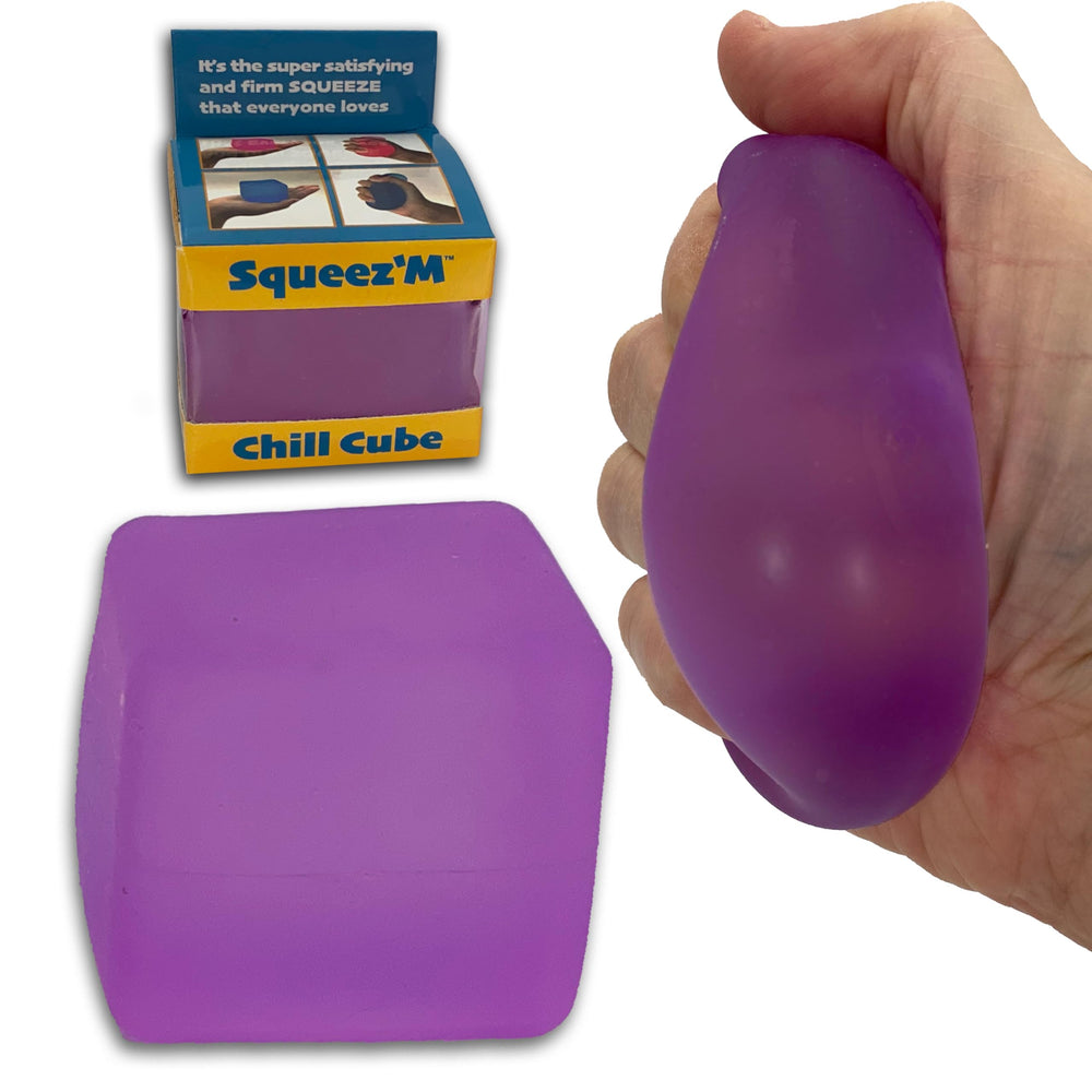 Squeez'M Chill Cube rests on a desk for discreet stress relief during work